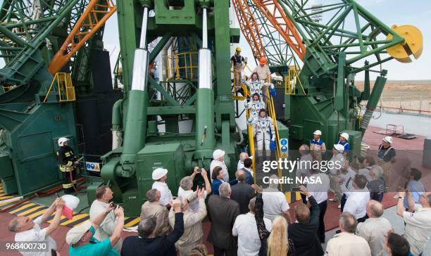 In this handout provided by the National Aeronautics and Space Administration , Expedition 56 flight engineer Alexander Gerst of ESA , top, flight...