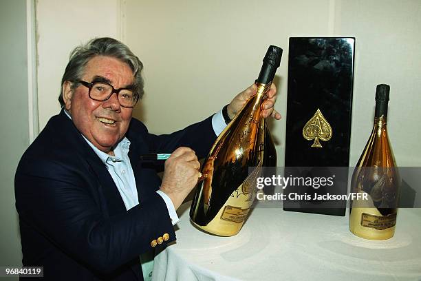 Ronnie Corbett signs a one-off Jeroboam of Armand de Brignac Champagne which was auctioned for Naomi Campbell's Fashion For Relief Haiti London 2010....