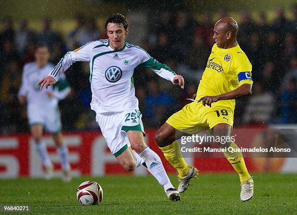 Marcos Senna of Villarreal competes for the ball with Christian Gentner of Wolfsburg during the UEFA Europa League football match between Villarreal...