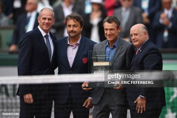Former Swedish tennis player Mats Wilander , poses with former French tennis player Henri Leconte , French Tennis Federation President Bernard...