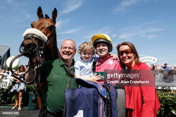 Jockey Andrew Thornton with his son Harry and wife Yvonne after riding Amirr to win The Abacus Decorators 'National Hunt' Maiden Hurdle on his last...