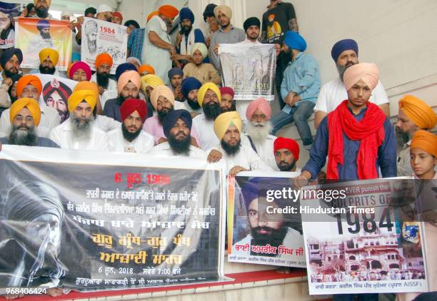 Members of Sikh Students Federation Mehta displaying posters of militant Jarnail Singh Bhindranwale and former Sikh Students Federation leader Amrik...
