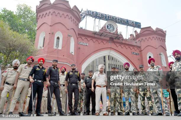 Security personnel deployed outside hall gate during a shutdown call given by radical Sikh organization 'Dal Khalsa' on the 34th anniversary of the...