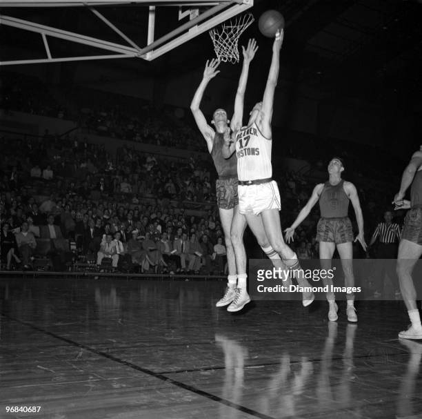 Bobby Houbregs of the Fort Wayne Zollner Pistons puts up a shot during a game in the 1955-56 season against the Rochester Royals at the War Memorial...