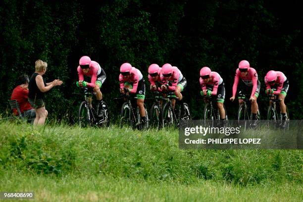 Spectator cheers as riders of USA's EF Education First - Drapac P/B - Cannondale cycling team compete during the third stage of the 70th edition of...