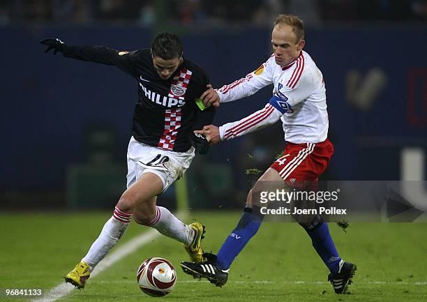 David Jarolim of Hamburg and Ibrahim Afellay of Eindhoven compete for the ball during the UEFA Europa League knock-out round, first leg match between...