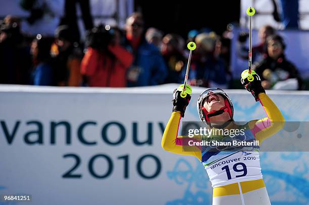 Maria Riesch of Germany celebrates after crossing the line during the Alpine Skiing Ladies Super Combined Slalom on day 7 of the Vancouver 2010...