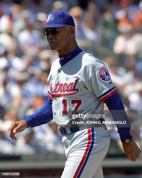 This 10 May 2001 file photo shows Montreal Expos manager Filipe Alou standing walking to the dugout during a game against the San Francisco Giants in...