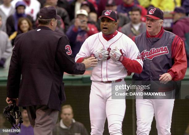 Cleveland Indians' catcher Sandy Alomar and manager Charlie Manuel argue Alomar's ejection with home plate umpire Tim Welke during the sixth inning...