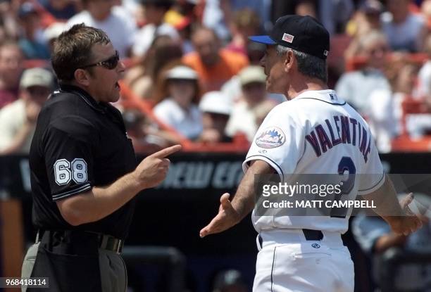 Home plate umpire Chris Guccione argues with New York Mets manager Bobby Valentine over a foul ball call on Florida Marlins shortstop Andy Fox in the...