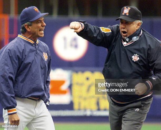 Second base umpire Frank Pulli loses his glasses as he throws New York Mets manager Bobby Valentine out of the game against the Pittsburgh Pirates 06...