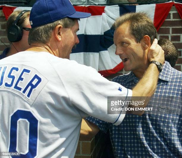 New National Baseball Hall of Fame member George Brett is embraced by Kansas City Royals manager Tony Muser before the Hall of Fame Game 26 July,...