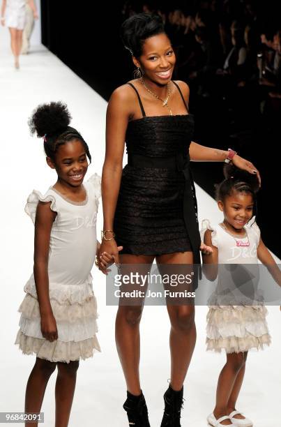 Jamelia and her children on the catwalk at the Fashion for Relief show for London Fashion Week Autumn/Winter 2010 at Somerset House on February 18,...