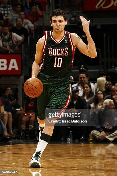 Carlos Delfino of the Milwaukee Bucks moves the ball up court during the game against the Miami Heat at American Airlines Arena on February 1, 2010...