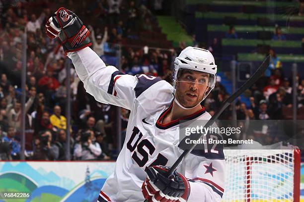 Ryan Malone of The United States celebrates after scoring his team's fourth goal during the ice hockey men's preliminary game between USA and Norway...