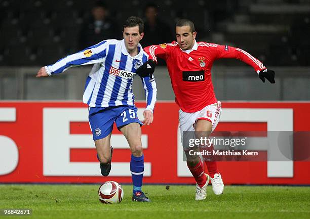 Ruben Amorim of Lisbon battles for the ball with Maximilian Nicu of Berlin during the UEFA Europa League knock-out round, first leg match between...