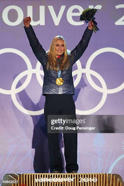 Lindsey Vonn of the United States reacts after receiving her gold medal during the medal ceremony for the Alpine Skiing Ladies Downhill on day 6 of...