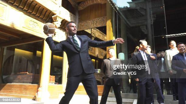 Former English footballer David Beckham plays a traditional Chinese Cuju ball at the Bengbu Ancient Buidings Expo Park ahead of the 2018 G-EXPO...