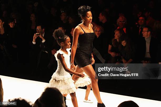 Jamelia and her children walks down the catwalk at Naomi Campbell's Fashion For Relief Haiti London 2010 Fashion Show at Somerset House on February...