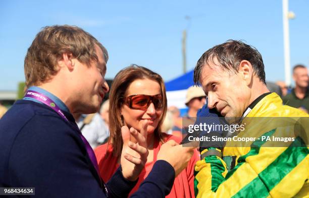 Jockey Andrew Thornton is interviewed by PA reporter Graham Clark in the parade ring after his final race as a jockey at Uttoxeter Racecourse.