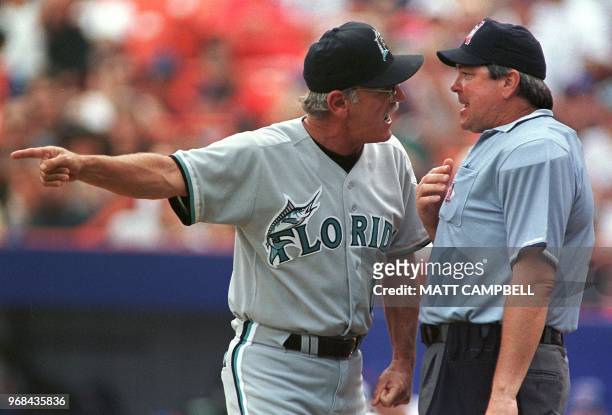 Florida Marlins' manager Jim Leyland argues with home plate umpire Dana DeMuth after DeMuth ejected Leyland from the game for arguing balls and...