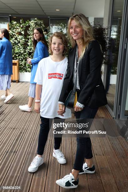 Interior designer Sarah Lavoine and her son Roman attend the 2018 French Open - Day Eleven at Roland Garros on June 6, 2018 in Paris, France.