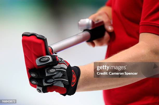 Member of the Great Britain team adjusts his broom during the men's curling round robin game between Great Britain and Sweden on day 5 of the...