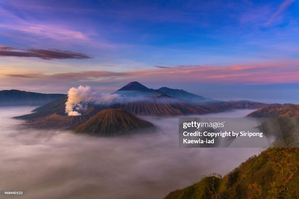 The tranquil scene of Mt.Bromo and Mt.Batok with the sea of fog in the morning, East Java, Indonesia.