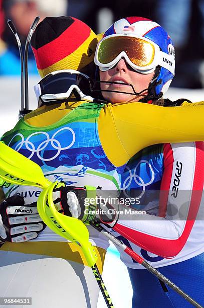 Maria Riesch of Germany hugs Lindsey Vonn of The United States after the Alpine Skiing Ladies Super Combined Slalom on day 7 of the Vancouver 2010...