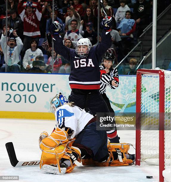 Gigi Marvin of The United States celebrates Meghan Duggan's goal during the ice hockey women's preliminary game between USA and Finland on day 7 of...