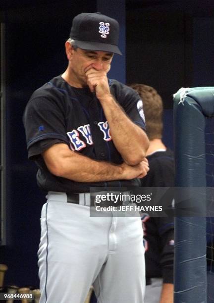 Manager Bobby Valentine of the New York Mets stands in the dugout 13 October during game two of the National League Championship Series against the...