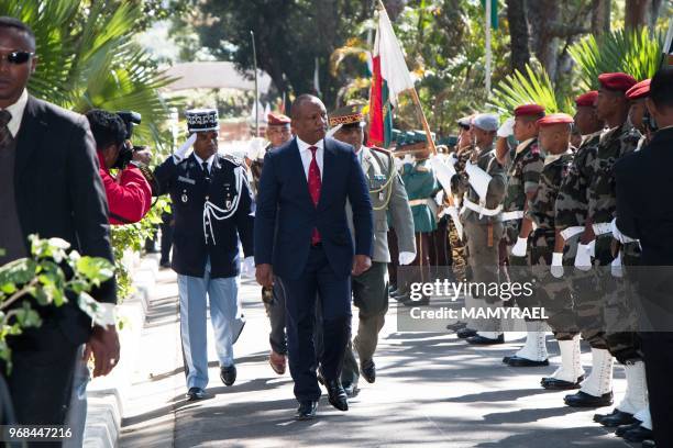 Newly nominated Malagasy Prime Minister Christian Ntsay reviews a guard of honour during his swearing in ceremony in Antananarivo on June 6, 2018.