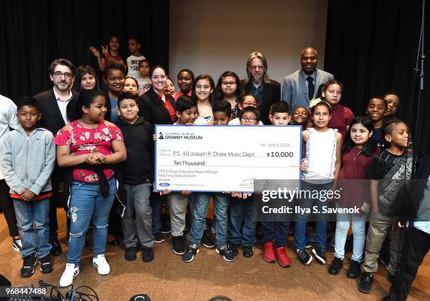 Nick Cucci, Pamela Alexander, Melissa Salguero, Scott Goldman and Dwayne Davilar pose during 2018 Music Educator Award Winner Check Presentation on...