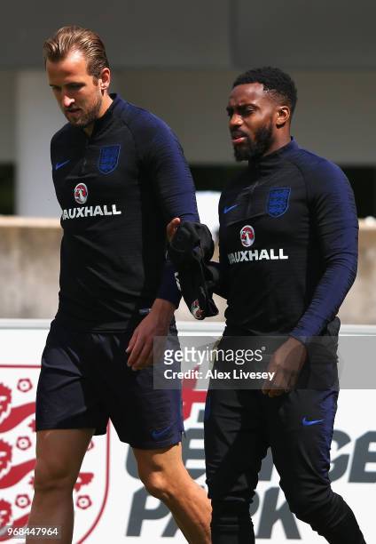 Harry Kane and Danny Rose of England walk out prior to during the England training session at St Georges Park on June 6, 2018 in Burton-upon-Trent,...