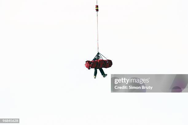 Winter Olympics: Romania Edith Miklos getting airlifted by helicopter after sustaining injury during Women's Downhill Final at Whistler Creekside....