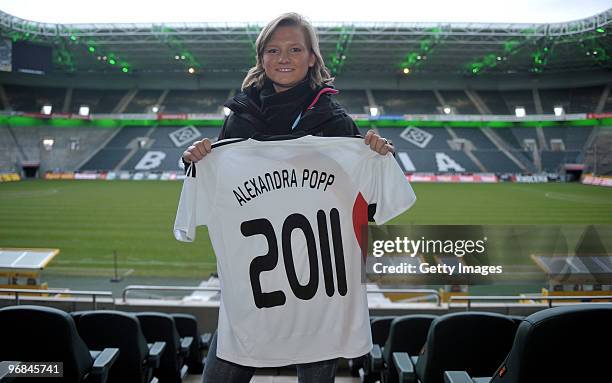 Alexandra Popp presents a jersey prior the FIFA Women's World Cup 2011 Countdown event at the Borussia Park Arena on February 18, 2010 in...