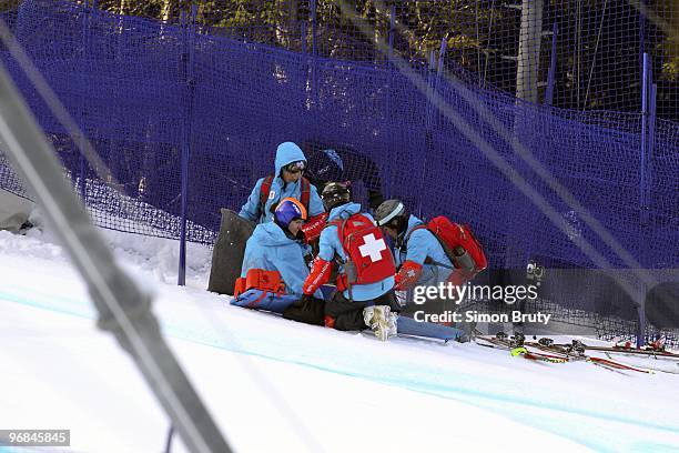 Winter Olympics: Romania Edith Miklos attended by medics after sustaining injury during Women's Downhill Final at Whistler Creekside. Whistler,...