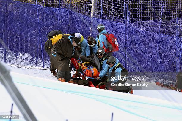 Winter Olympics: Romania Edith Miklos attended by medics after sustaining injury during Women's Downhill Final at Whistler Creekside. Whistler,...