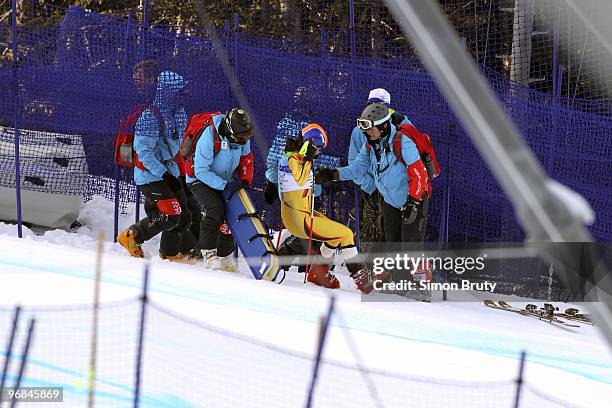 Winter Olympics: Romania Edith Miklos attended by medics after sustaining injury during Women's Downhill Final at Whistler Creekside. Whistler,...