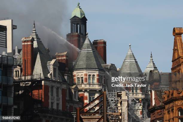 Firefighters battle a fire at Mandarin Oriental Hotel on June 6, 2018 in London, England. Around 100 firefighters are attending a large fire at a...