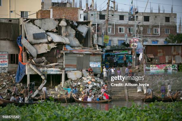 People are seen at the Buriganga river on June 5, 2018 in Dhaka, Bangladesh. Bangladesh has been reportedly ranked 10th out of the top 20 plastic...