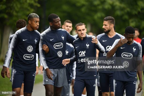 France's defender Presnel Kimpembe, midfielder Paul Pogba, foward Antoine Griezmann, foward Olivier Giroud, and foward Ousmane Dembele arrive for a...