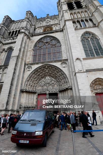 People stand outside a church of Sens during the funeral of murdered French au-pair Sophie Lionnet on June 6, 2018. - A French couple was on May 24,...