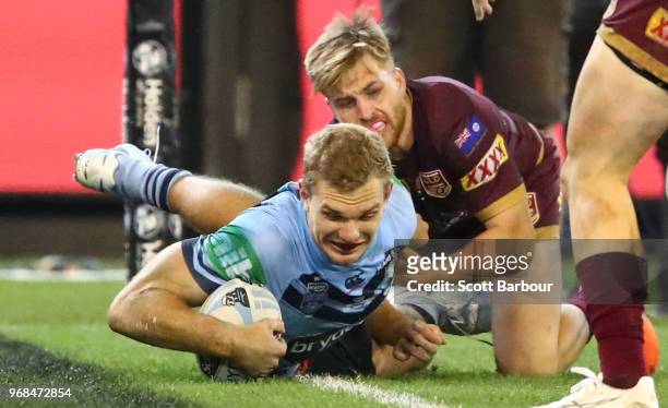 Tom Trbojevic of the Blues scores a try during game one of the State Of Origin series between the Queensland Maroons and the New South Wales Blues at...