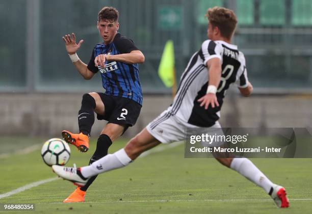 Federico Valietti of FC Internazionale is challenged by Alessandro Tripaldelli of Juventus during the Serie A Primavera Playoff match between...