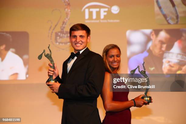 Girls World Champion, Whitney Osuigwe of The United States and Boys world Champion Axel Geller of Argentina collect their awards during the ITF World...