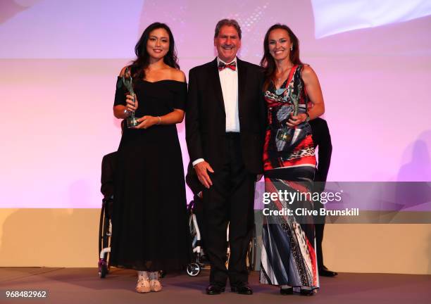 Womens doubles World Champions Latisha Chan and Martina Hingis pose with ITF President David Haggerty as they collect their awards during the ITF...