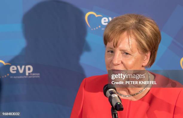 German Chancellor Angela Merkel reacts as she makes a press statement on June 6, 2018 in Munich, southern Germany. - The Group of the European...