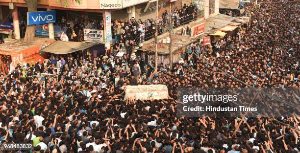 Massive procession is seen commemorating the martyrdom of Hazrat Imam Ali on 21st day of Ramzan in the old city area on June 6, 2018 in Lucknow,...