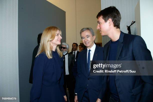 Louis Vuitton's executive vice president Delphine Arnault, Owner of LVMH Luxury Group Bernard Arnault and CEO of Rimowa, Alexandre Arnault attend the...